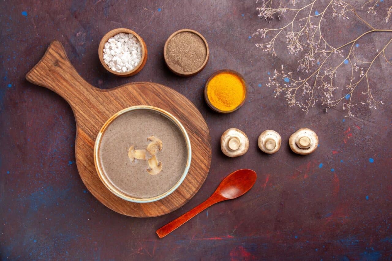 Umami mushroom soup, surrounded by different spices